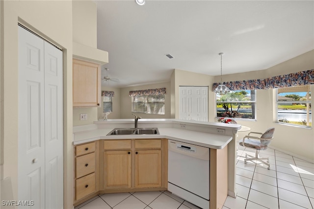 kitchen featuring kitchen peninsula, dishwasher, light brown cabinets, and sink