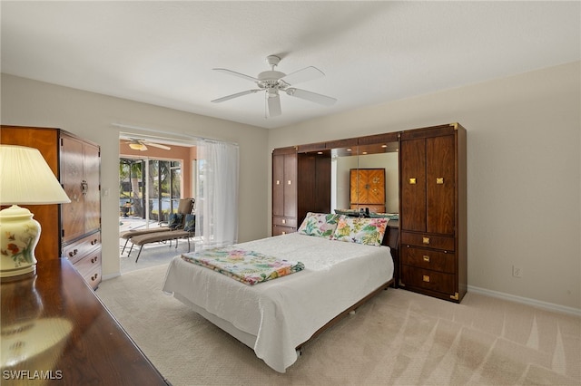 carpeted bedroom with ceiling fan and access to outside