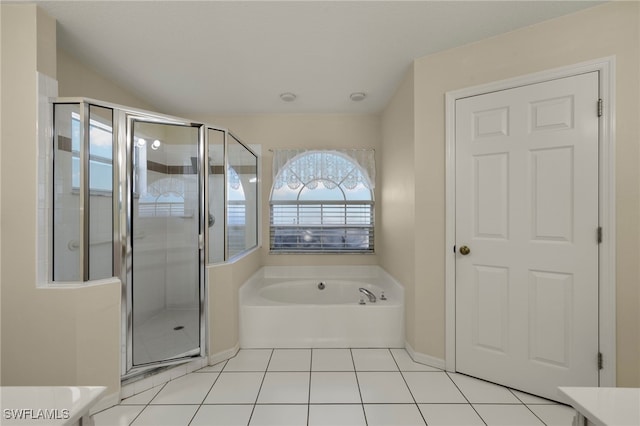 bathroom featuring vanity, tile patterned floors, and plus walk in shower