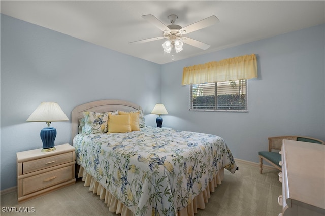 bedroom with light colored carpet and ceiling fan