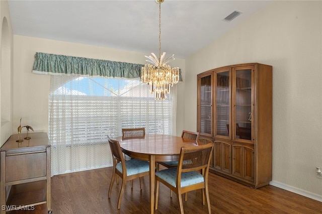 dining space featuring an inviting chandelier and wood-type flooring