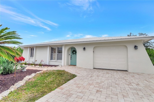 single story home with a garage