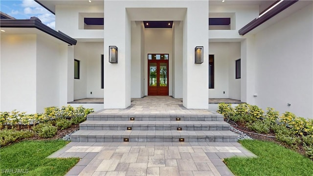 view of exterior entry featuring french doors