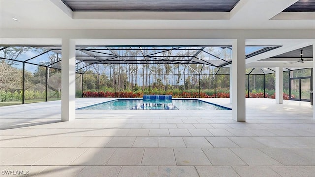 view of swimming pool featuring a patio area, a lanai, and pool water feature