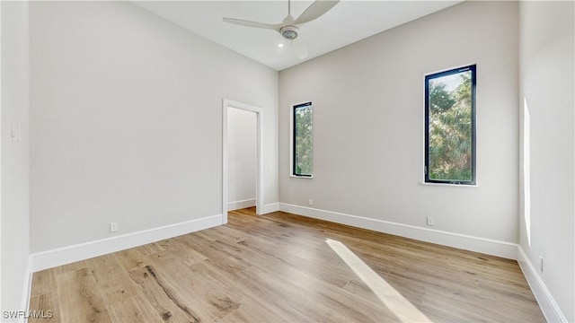 unfurnished room with ceiling fan, light hardwood / wood-style floors, and a healthy amount of sunlight