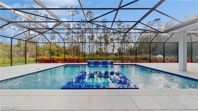 view of swimming pool featuring glass enclosure, pool water feature, and a patio area