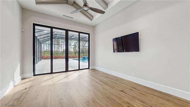 empty room featuring light wood-type flooring and ceiling fan