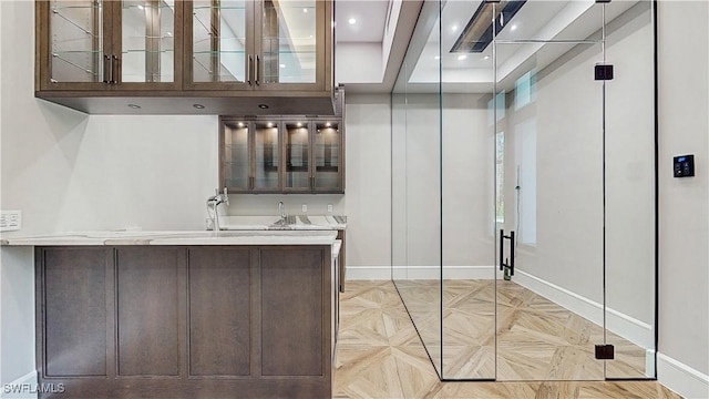 interior space with dark brown cabinets and pendant lighting