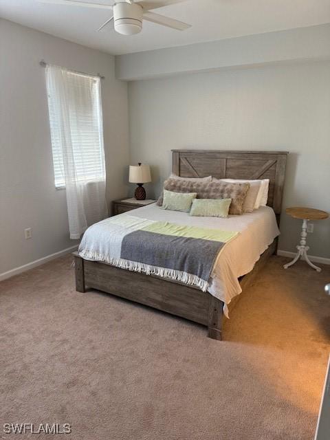 bedroom with ceiling fan and carpet