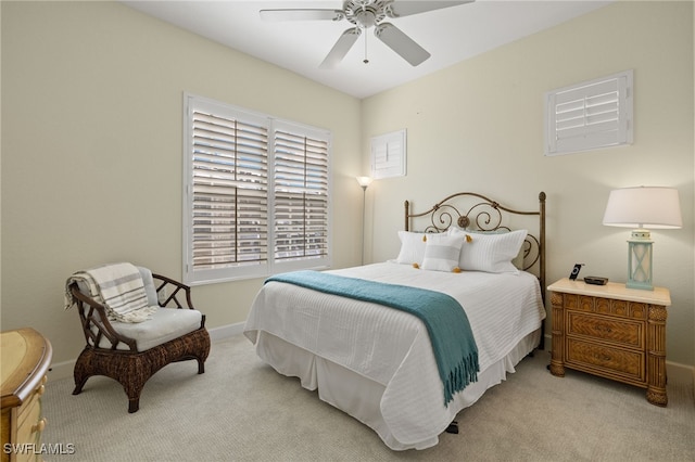 bedroom featuring ceiling fan and light colored carpet