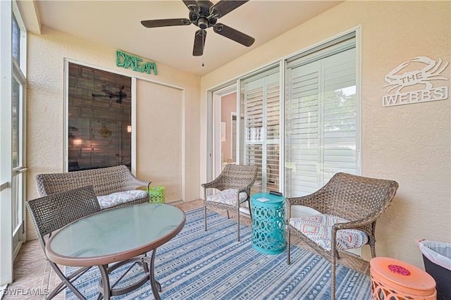 sunroom / solarium with ceiling fan