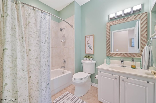 full bathroom featuring tile patterned flooring, shower / bath combo with shower curtain, vanity, and toilet