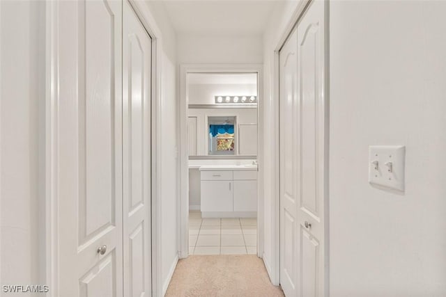 hallway with light tile patterned floors