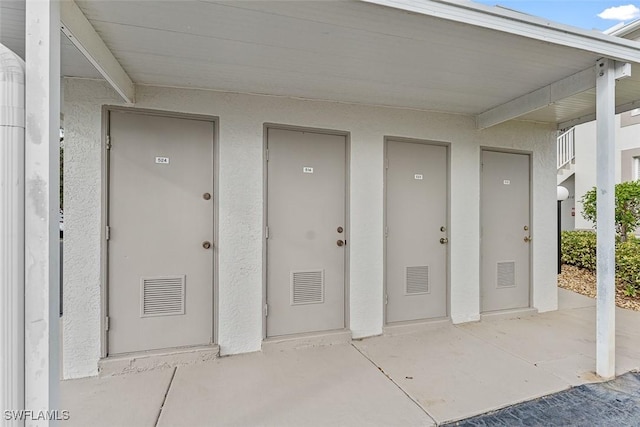 doorway to property with a patio area