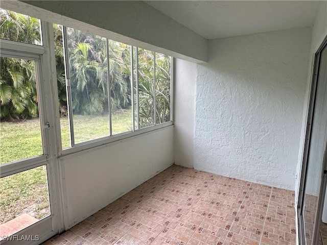 unfurnished sunroom with plenty of natural light