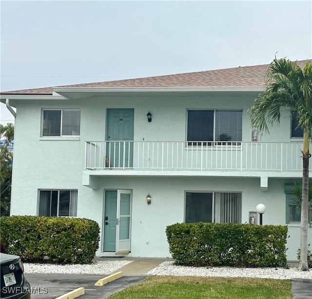 view of front of house with a balcony