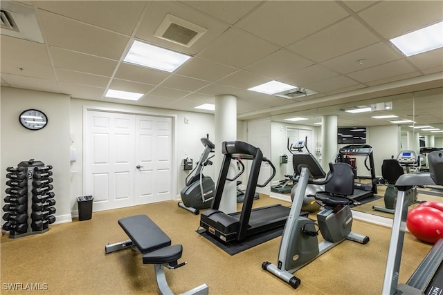 exercise room with a drop ceiling