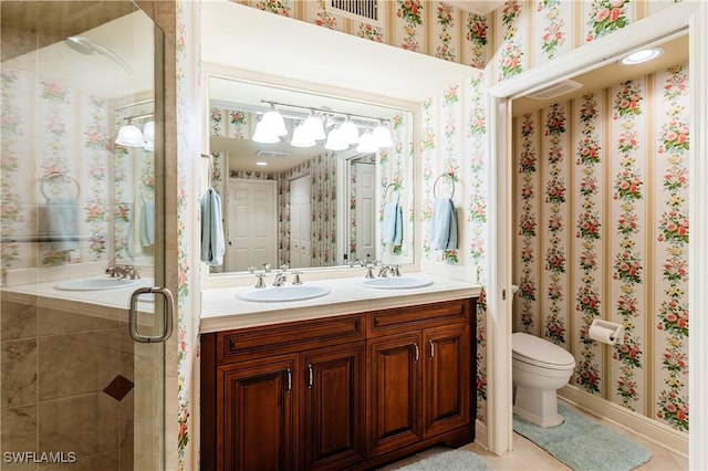 bathroom with walk in shower, vanity, and toilet