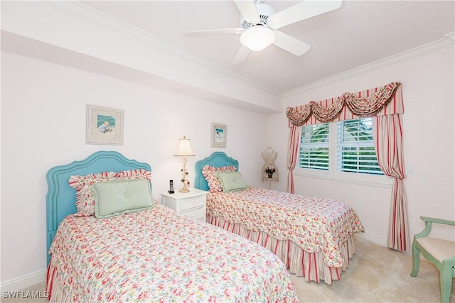 carpeted bedroom featuring ornamental molding and ceiling fan