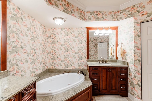 bathroom with vanity, ornamental molding, and a tub