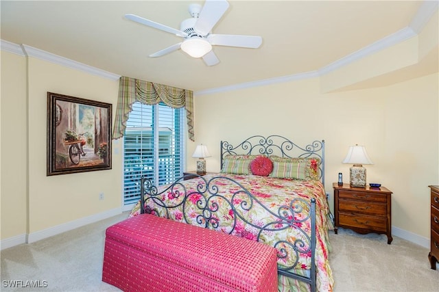 carpeted bedroom featuring ceiling fan and ornamental molding