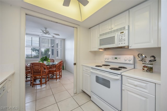 kitchen with white appliances, ceiling fan, white cabinets, and light tile patterned flooring