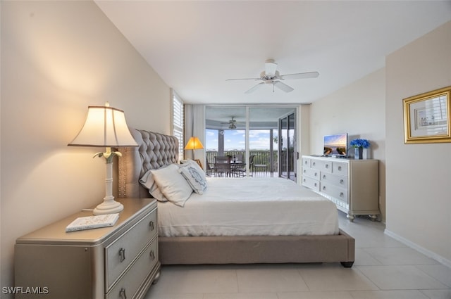 bedroom featuring expansive windows, baseboards, and a ceiling fan