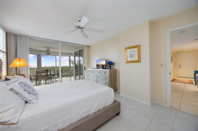 bedroom featuring baseboards, ceiling fan, access to exterior, expansive windows, and light tile patterned flooring