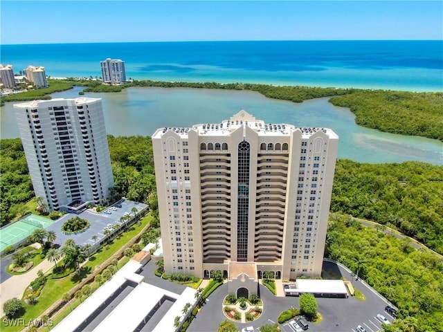 drone / aerial view featuring a water view and a city view