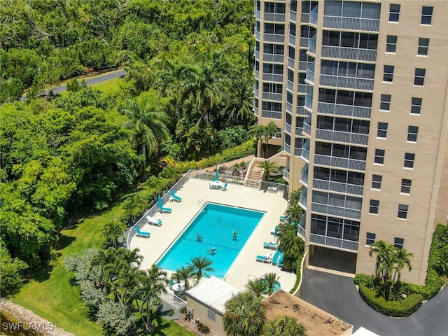 pool featuring a patio and stairway