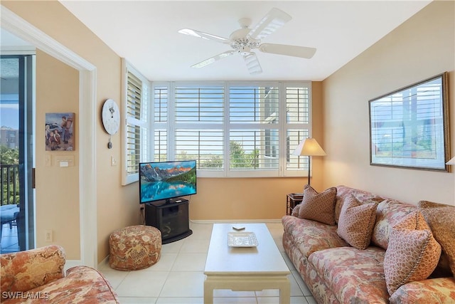 living room with ceiling fan and tile patterned floors