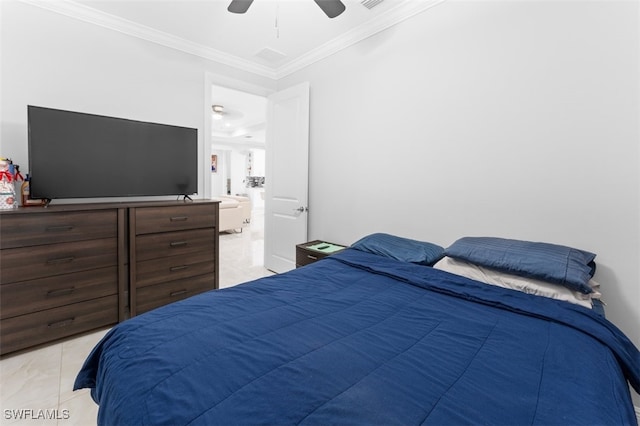 bedroom with ceiling fan, light tile patterned floors, and crown molding