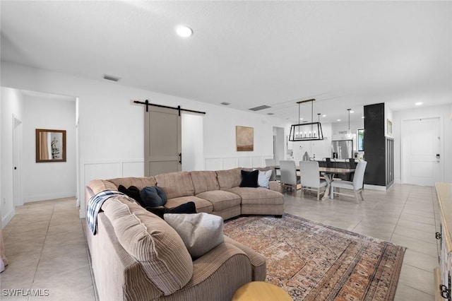 tiled living room with a barn door