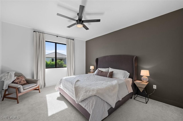 bedroom featuring light colored carpet and ceiling fan