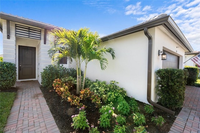 view of side of property featuring a garage