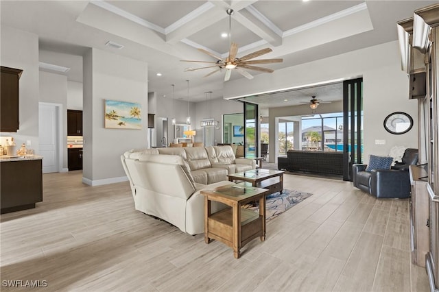 living room with ceiling fan, ornamental molding, beam ceiling, and coffered ceiling