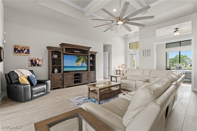 living room featuring ceiling fan, beamed ceiling, coffered ceiling, and ornamental molding