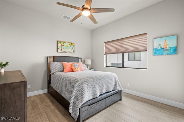 bedroom featuring ceiling fan and light hardwood / wood-style floors