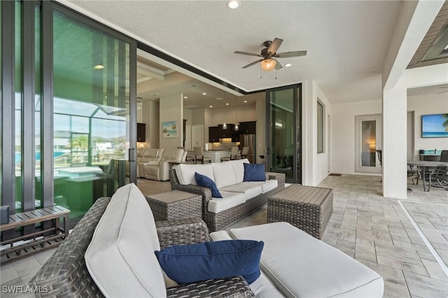 view of patio / terrace featuring ceiling fan and an outdoor hangout area