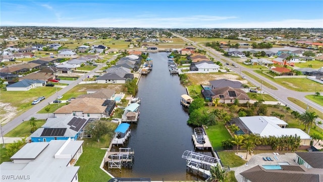 birds eye view of property featuring a water view and a residential view