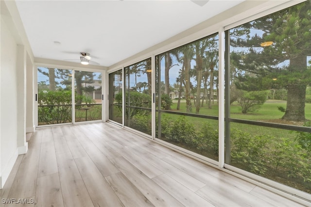 unfurnished sunroom with ceiling fan and a wealth of natural light