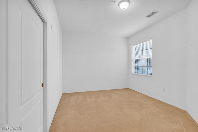 unfurnished room with light colored carpet