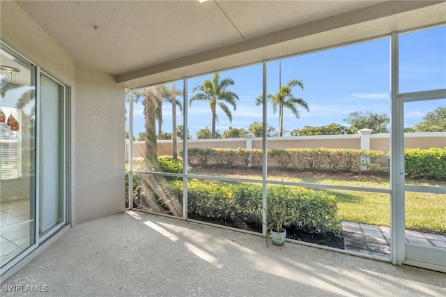 unfurnished sunroom featuring plenty of natural light