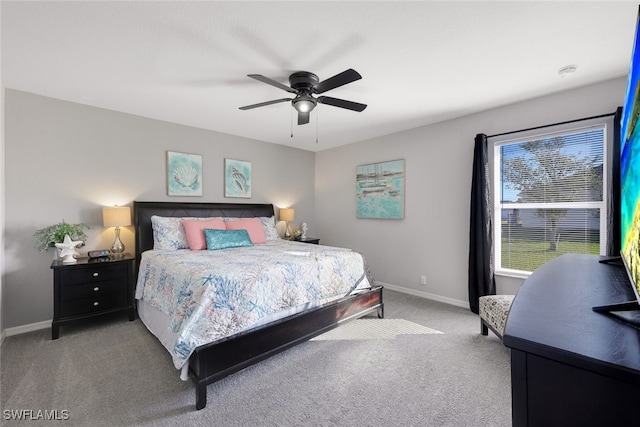 bedroom featuring light colored carpet and ceiling fan