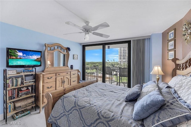 bedroom with access to outside, ceiling fan, and floor to ceiling windows