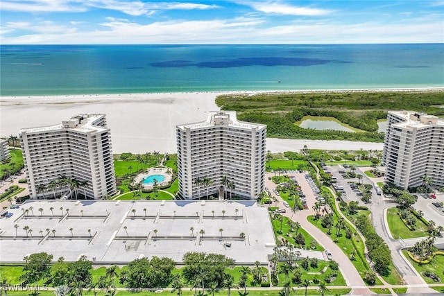 drone / aerial view with a view of the beach and a water view