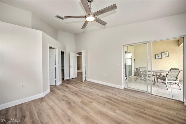 interior space with ceiling fan and light hardwood / wood-style flooring