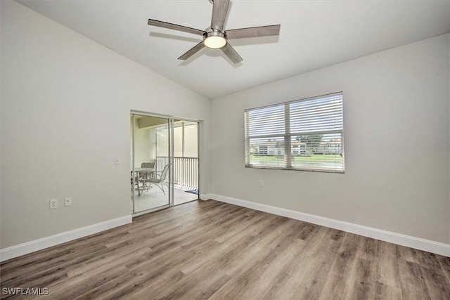 unfurnished room with ceiling fan, light hardwood / wood-style flooring, and vaulted ceiling