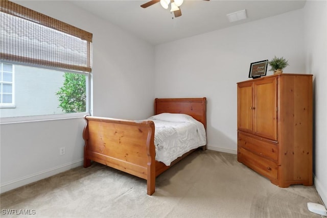 carpeted bedroom featuring ceiling fan