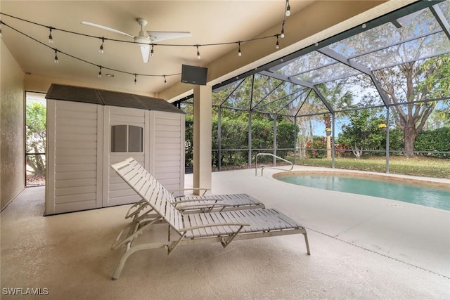 view of pool featuring a patio area and glass enclosure